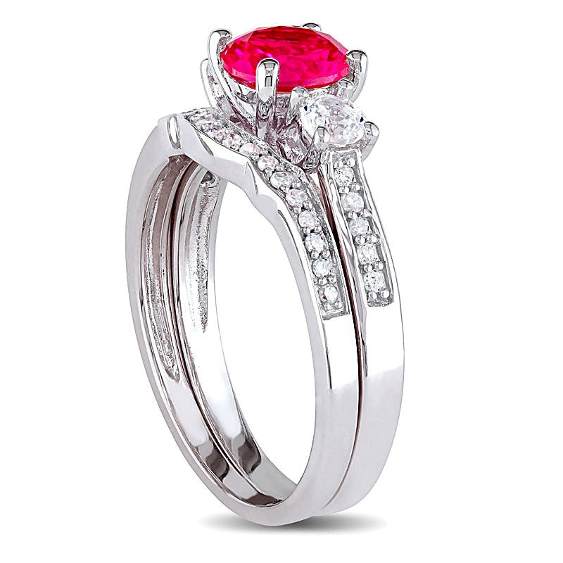6.0mm Lab-Created Ruby and White Sapphire with 0.13 CT. TW Diamond Three Stone Bridal Set in 10K White Gold