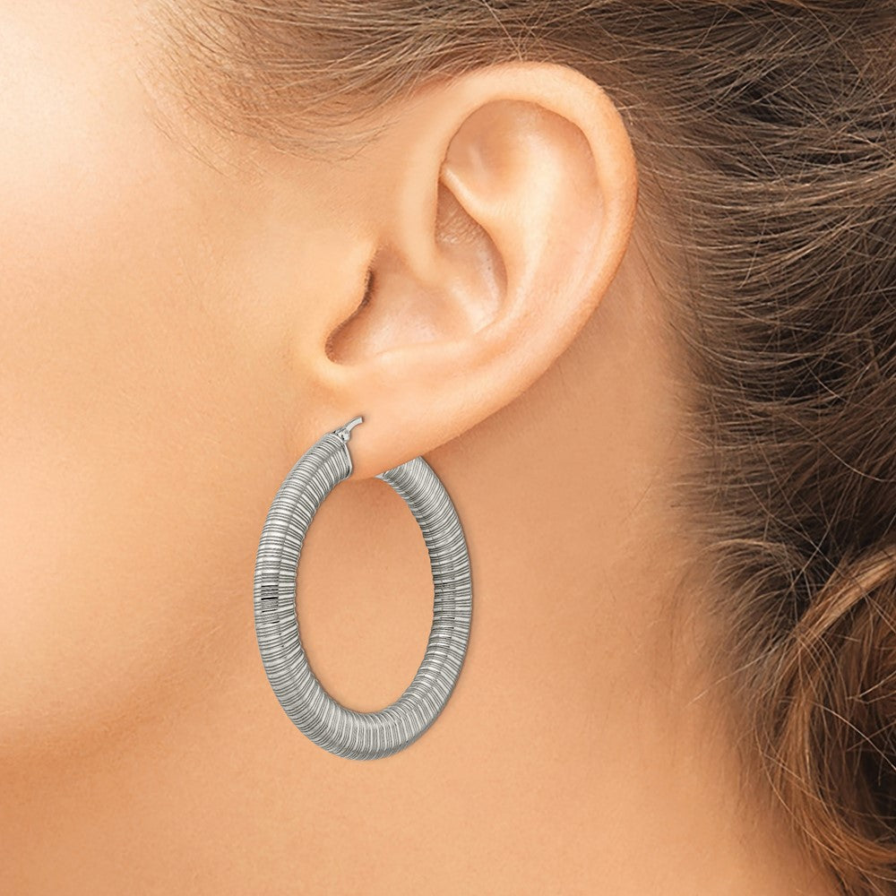 Stainless Steel Polished And Textured Hollow Hoop Earrings