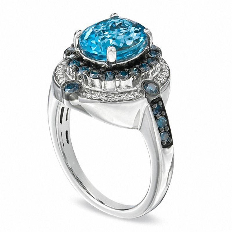 Oval Blue Topaz and 0.75 CT. T.W. Enhanced Blue and White Natural Diamond Ring in Sterling Silver