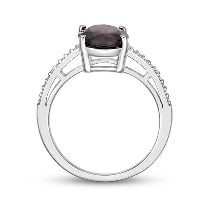 Oval Garnet and Natural Diamond Accent Ring in Sterling Silver