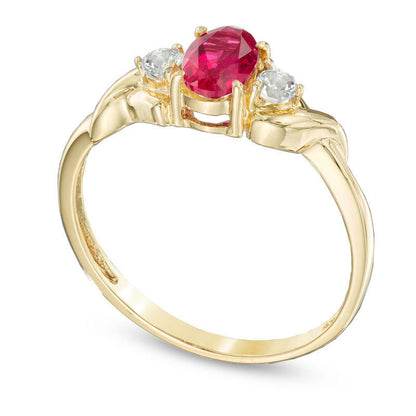 Oval Lab-Created Ruby and White Topaz Ring in Solid 10K Yellow Gold