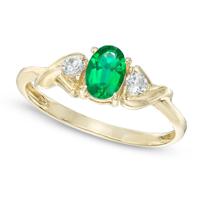 Oval Lab-Created Emerald and White Topaz Ring in Solid 10K Yellow Gold
