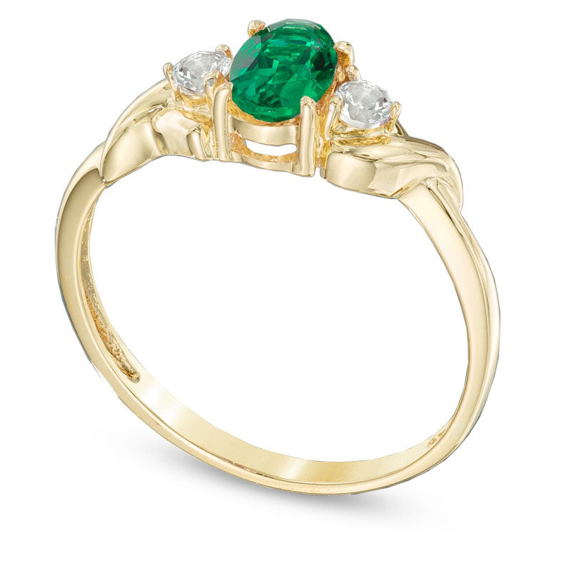 Oval Lab-Created Emerald and White Topaz Ring in Solid 10K Yellow Gold