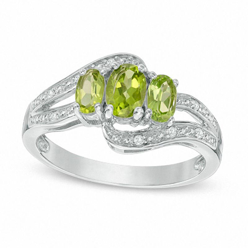 Oval Peridot and White Topaz Three Stone Bypass Ring in Sterling Silver