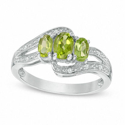 Oval Peridot and White Topaz Three Stone Bypass Ring in Sterling Silver