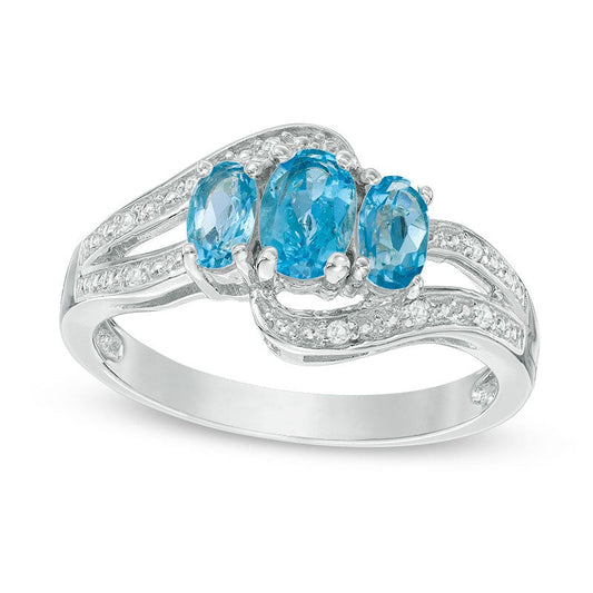 Oval Blue and White Topaz Three Stone Bypass Ring in Sterling Silver