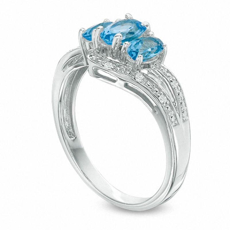 Oval Blue and White Topaz Three Stone Bypass Ring in Sterling Silver