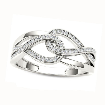 0.13 CT. T.W. Natural Diamond Interlocking Loops Twist Ring in Solid 10K White Gold