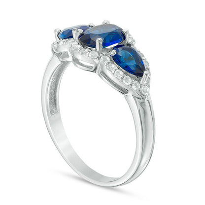 Oval and Pear-Shaped Lab-Created Blue Sapphire with White Topaz Frame Three Stone Ring in Sterling Silver