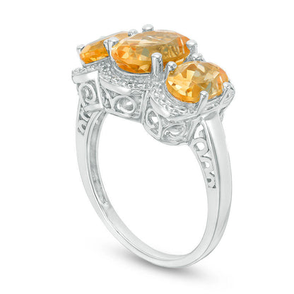 Oval Citrine and Natural Diamond Accent Three Stone Frame Ring in Sterling Silver