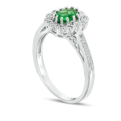 Oval Lab-Created Emerald and 0.17 CT. T.W. Diamond Flower Frame Engagement Ring in Sterling Silver