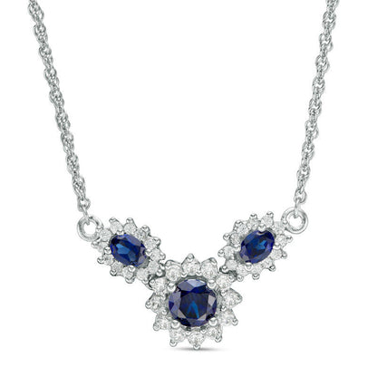 Oval and Round Lab-Created Blue and White Sapphire Sunburst Frame Three Stone Necklace in Sterling Silver