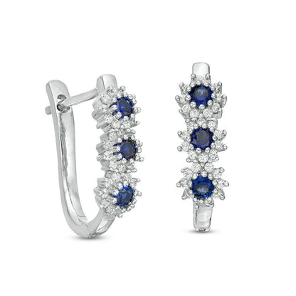 Lab-Created Blue Sapphire and 0.2 CT. T.W. Diamond Three Stone Sunburst Hoop Earrings in 10K White Gold