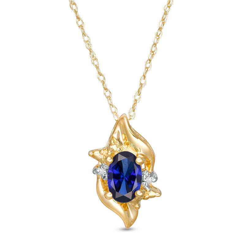 Oval Lab-Created Blue Sapphire and Diamond Accent Flame Burst Pendant in 10K Yellow Gold