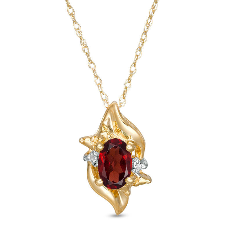 Oval Lab-Created Garnet and Diamond Accent Flame Burst Pendant in 10K Yellow Gold