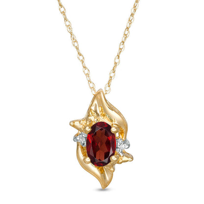 Oval Lab-Created Garnet and Diamond Accent Flame Burst Pendant in 10K Yellow Gold