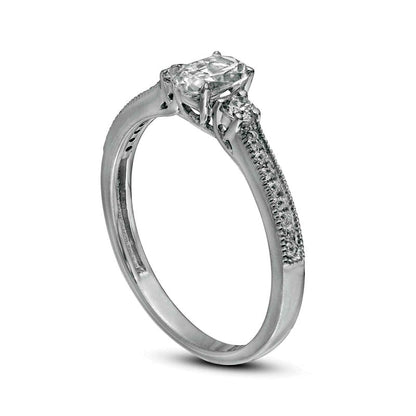 0.63 CT. T.W. Oval and Round Natural Diamond Three Stone Engagement Ring in Solid 14K White Gold