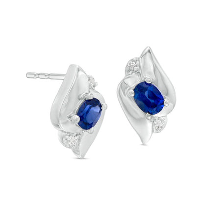 Oval Blue Sapphire and Diamond Accent Flame Stud Earrings in 14K White Gold