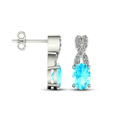 Oval Aquamarine and 0.07 CT. T.W. Diamond X" Drop Earrings in 10K White Gold"