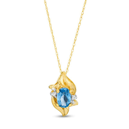 Oval Lab-Created Blue Zircon and Diamond Accent Flame Pendant in 10K Yellow Gold