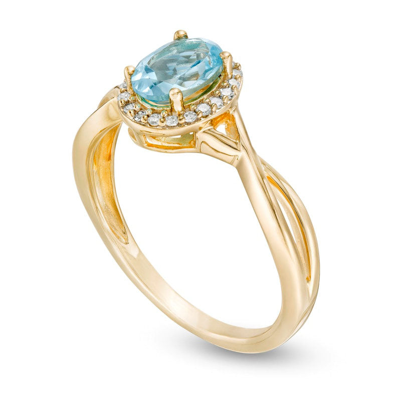 Oval Swiss Blue Topaz and 0.07 CT. T.W. Natural Diamond Frame Twist Shank Ring in Solid 10K Yellow Gold