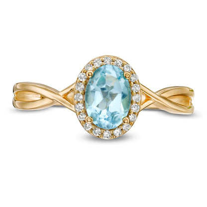 Oval Swiss Blue Topaz and 0.07 CT. T.W. Natural Diamond Frame Twist Shank Ring in Solid 10K Yellow Gold