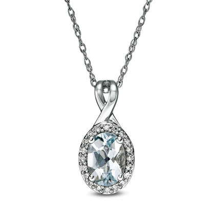 Oval Aquamarine and 0.07 CT. T.W. Natural Diamond Frame Pendant in 10K White Gold