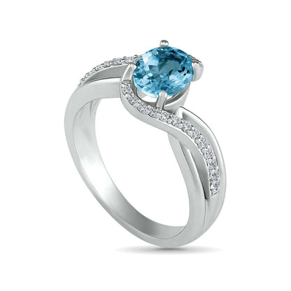 Oval Aquamarine and 0.10 CT. T.W. Natural Diamond Bypass Split Shank Bridal Engagement Ring Set in Sterling Silver