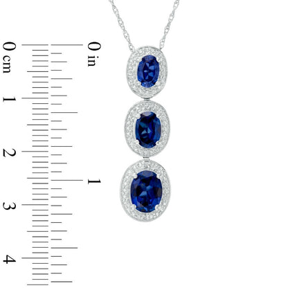 Oval Lab-Created Blue Sapphire and Diamond Accent Frame Three Stone Pendant in Sterling Silver