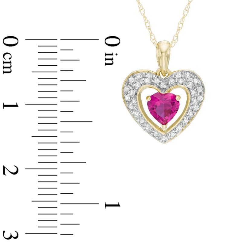 5.0mm Heart-Shaped Lab-Created Ruby and 0.13 CT. T.W. Diamond Frame Heart Pendant in 10K Yellow Gold
