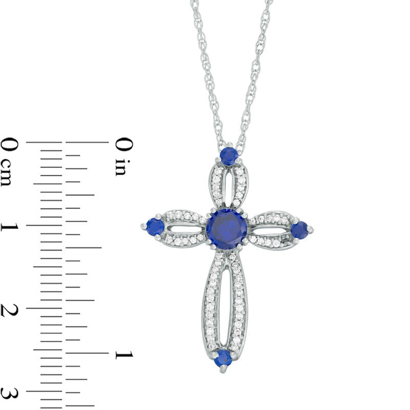 5.0mm Lab-Created Blue Sapphire and 0.2 CT. T.W. Diamond Loop Cross Pendant in Sterling Silver