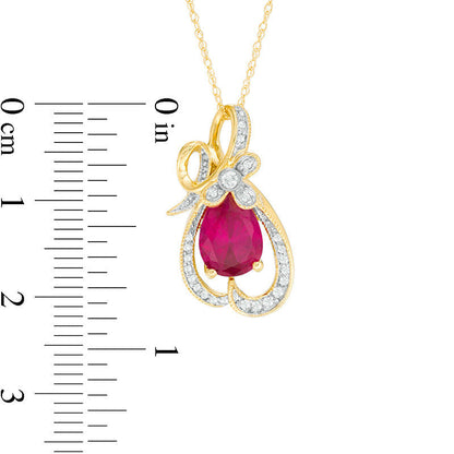 Pear-Shaped Lab-Created Ruby and 0.13 CT. T.W. Diamond Antique Vintage-Style Looping Ribbon Pendant in 10K Yellow Gold
