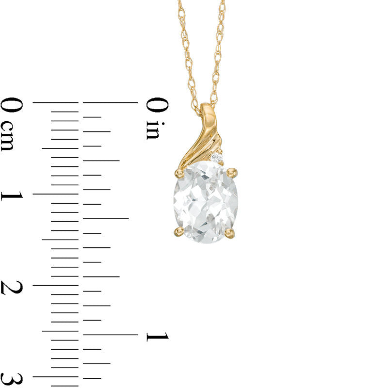 Oval Lab-Created White Sapphire and Diamond Accent Swirl Top Pendant in 10K Yellow Gold