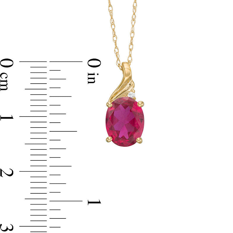 Oval Lab-Created Ruby and Diamond Accent Swirl Top Pendant in 10K Yellow Gold