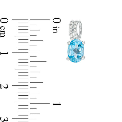 Oval Blue Topaz and 0.07 CT. T.W. Diamond Drop Earrings in 10K White Gold