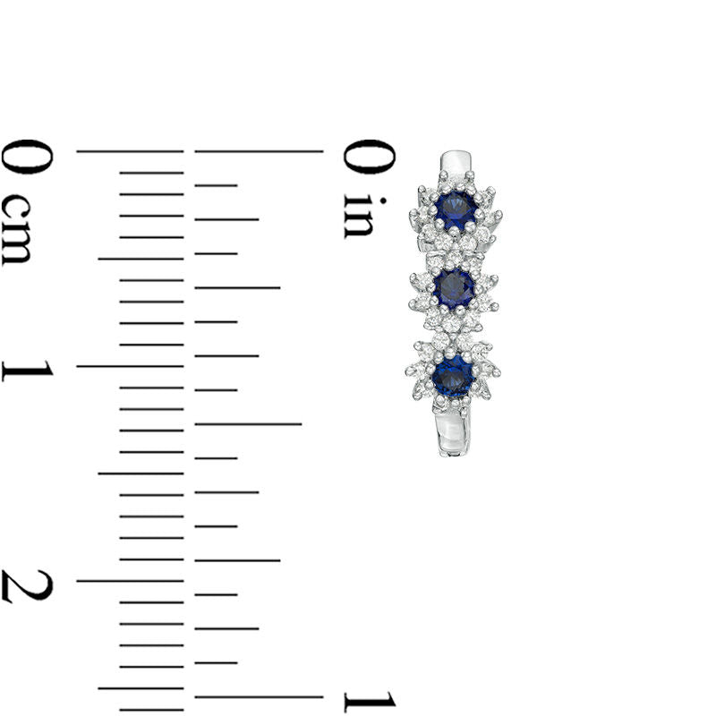 Lab-Created Blue Sapphire and 0.2 CT. T.W. Diamond Three Stone Sunburst Hoop Earrings in 10K White Gold