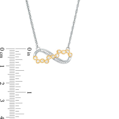 0.17 CT. T.W. Scattered Natural Diamond Sideways Infinity Necklace in 10K Two-Tone Gold