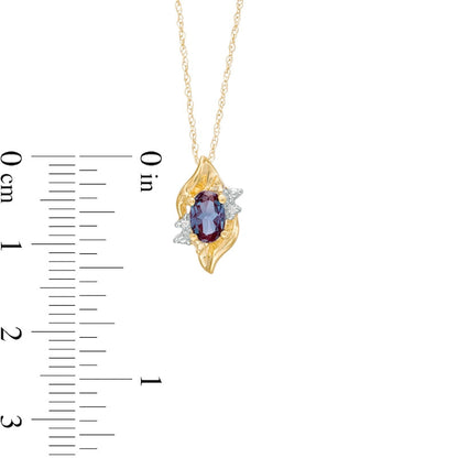 Oval Lab-Created Alexandrite and Diamond Accent Flame Burst Pendant in 10K Yellow Gold