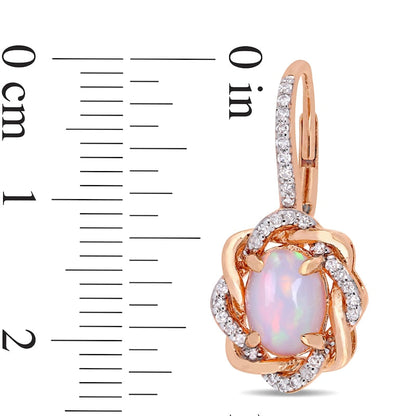 Oval Pink Opal and 0.25 CT. T.W. Diamond Twist Frame Drop Earrings in 10K Rose Gold