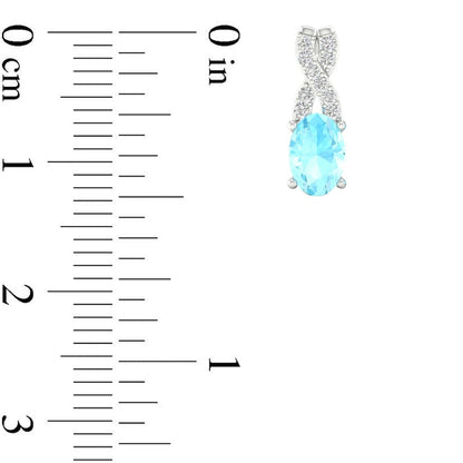 Oval Aquamarine and 0.07 CT. T.W. Diamond X" Drop Earrings in 10K White Gold"