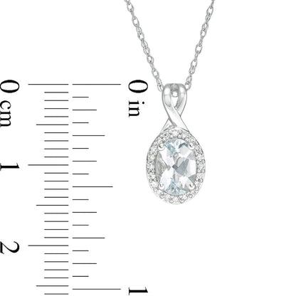 Oval Aquamarine and 0.07 CT. T.W. Natural Diamond Frame Pendant in 10K White Gold