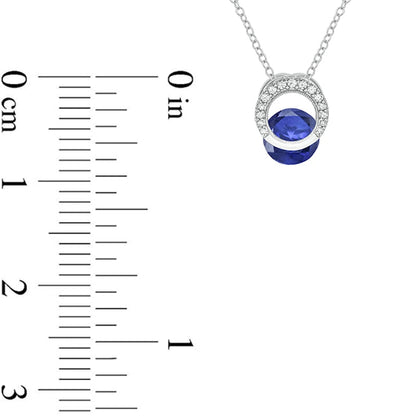 Lab-Created Blue Sapphire and 0.1 CT. T.W. Diamond Milgrain Open Circle Clip-Style Pendant in Sterling Silver