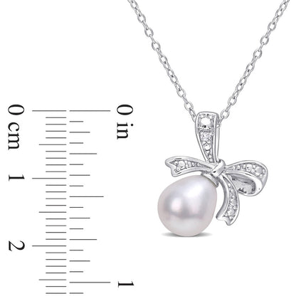 8.5-9.0mm Oval Cultured Freshwater Pearl and Natural Diamond Accent Bow Pendant in Sterling Silver