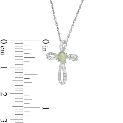 Oval Opal and 0.1 CT. T.W. Natural Diamond Pinwheel Cross Pendant in 10K White Gold